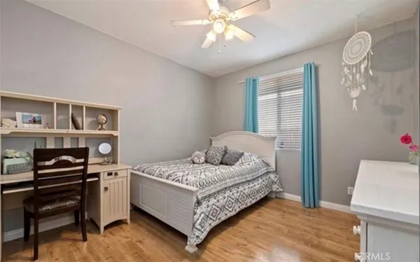 a bedroom with a bed and a bookshelf