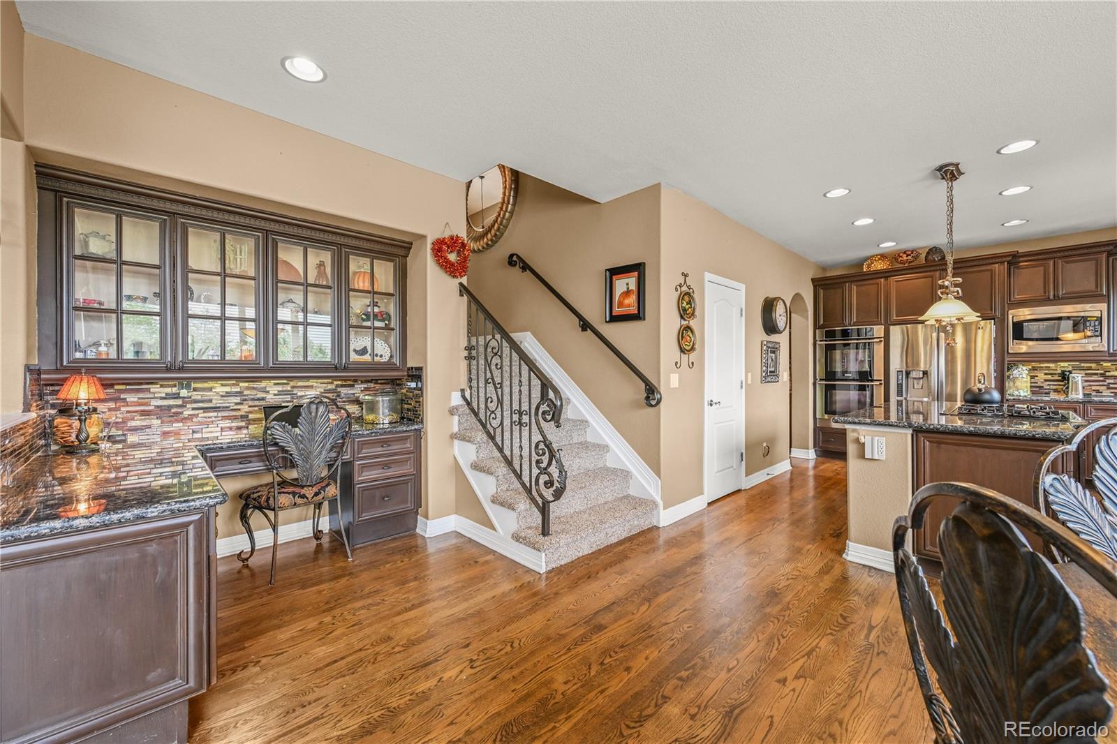 8518 High Ridge Court Castle Pines, CO 80108 - Photo 11 of 29 a view of a livingroom with furniture hardwood floor and staircase