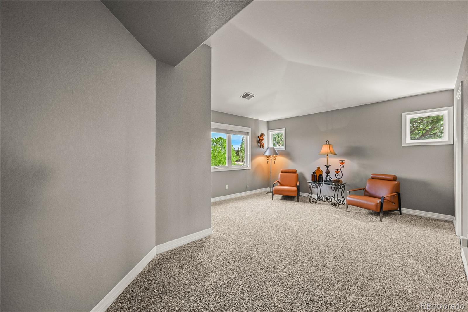 8518 High Ridge Court Castle Pines, CO 80108 - Photo 20 of 29 a living room with furniture and a window