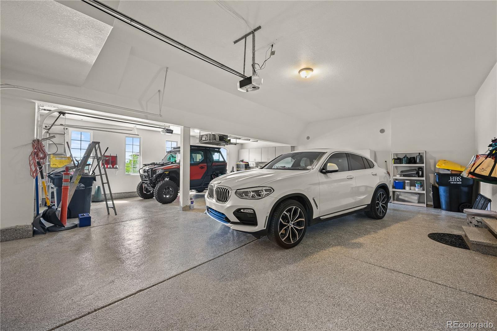 8518 High Ridge Court Castle Pines, CO 80108 - Photo 23 of 29 a view of a garage with parked cars