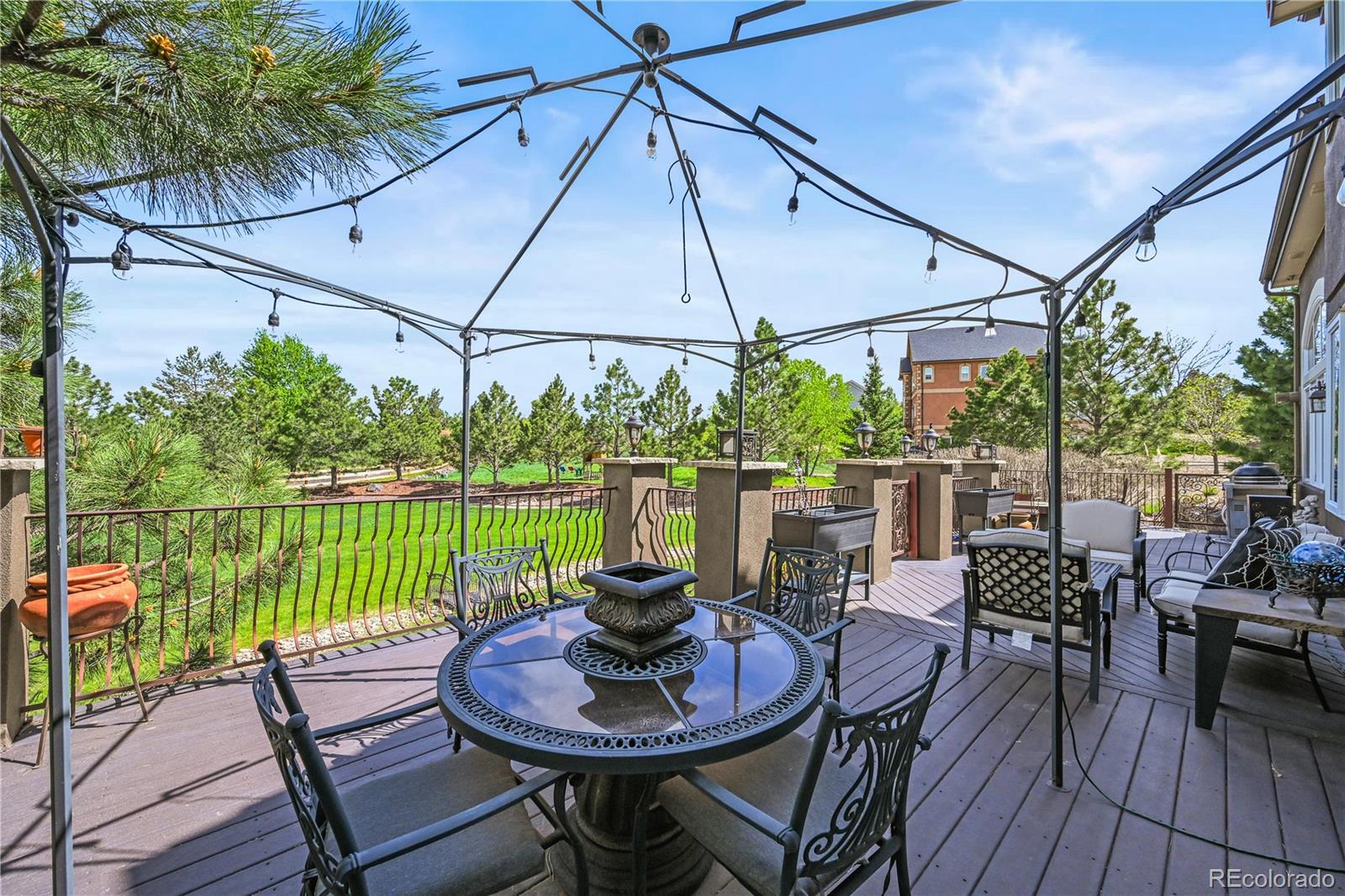 8518 High Ridge Court Castle Pines, CO 80108 - Photo 25 of 29 a outdoor view with a sitting space and large trees