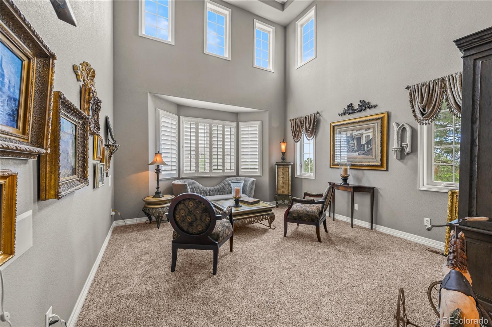 8518 High Ridge Court Castle Pines, CO 80108 - Photo 6 of 29 a living room with furniture and a window
