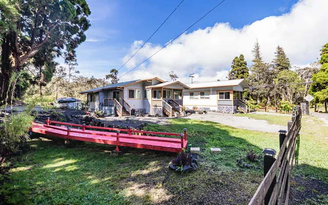 a view of a house with a yard porch and sitting area