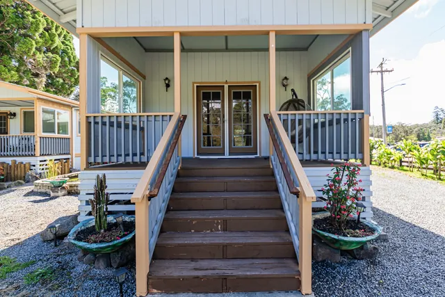 a view of stairs with wooden floor and fence