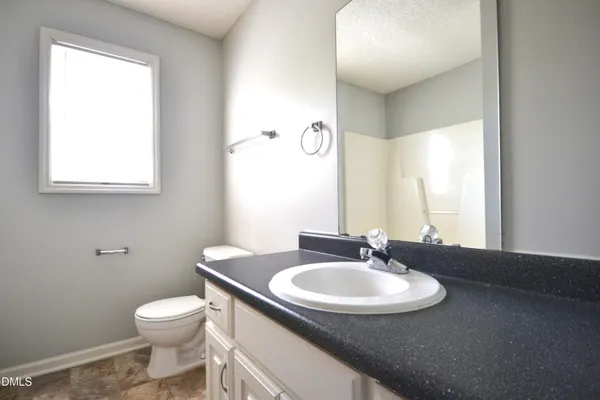 a bathroom with a bathtub and a sink