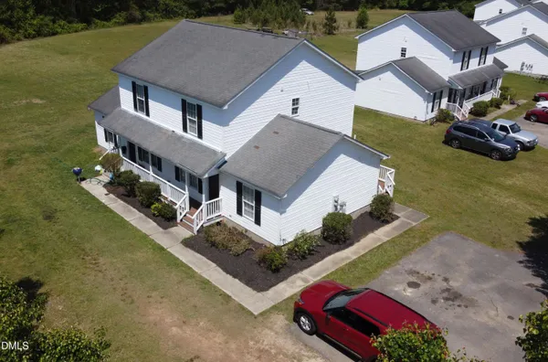 an aerial view of a house with a garden