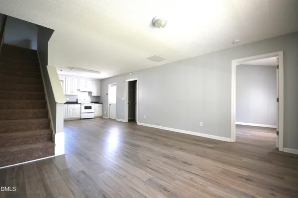 a view of a livingroom with wooden floor