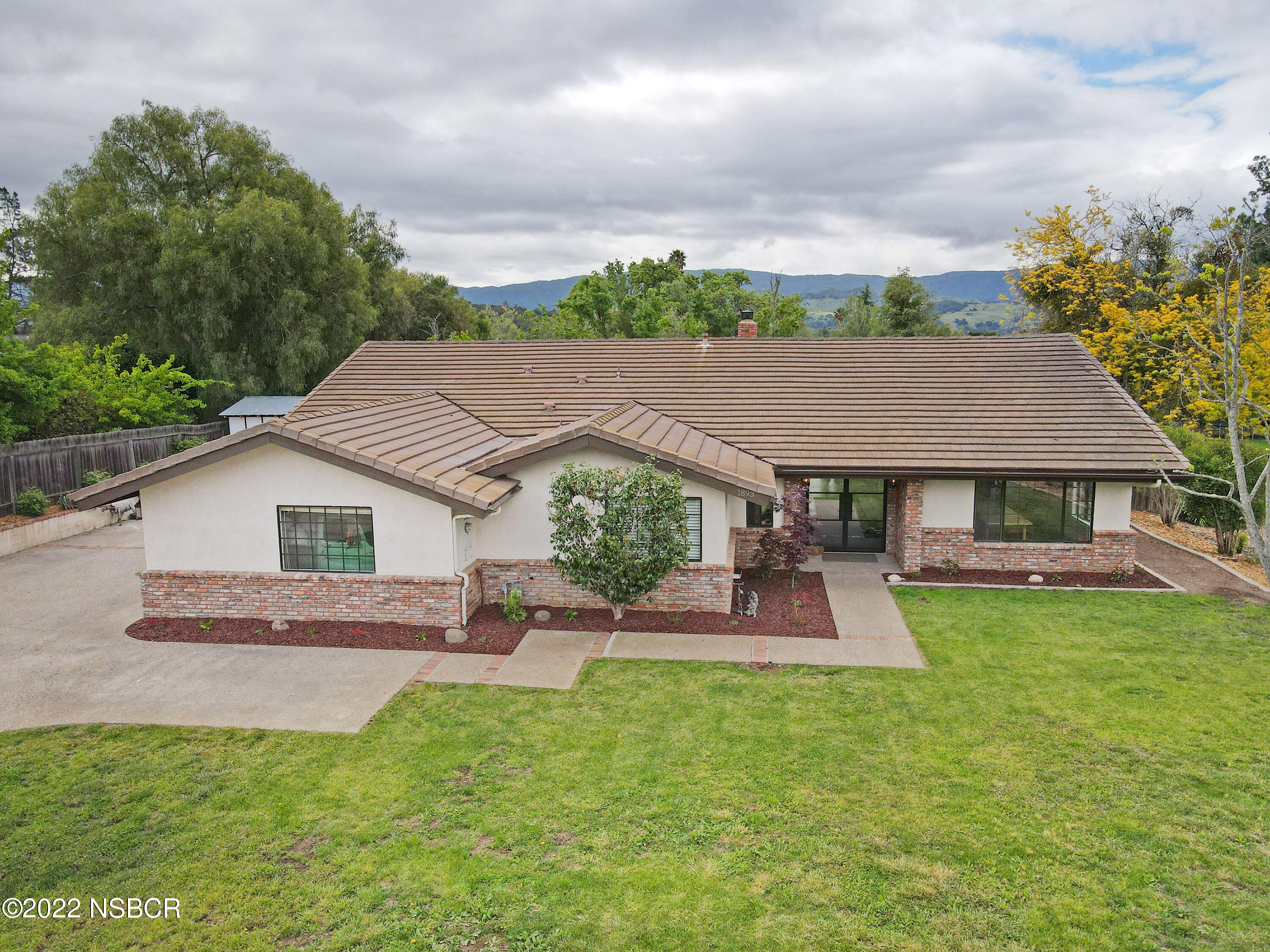 1893 Ringsted Drive Solvang, CA 93463 - Photo 1 of 43 a aerial view of a house with a yard table and chairs