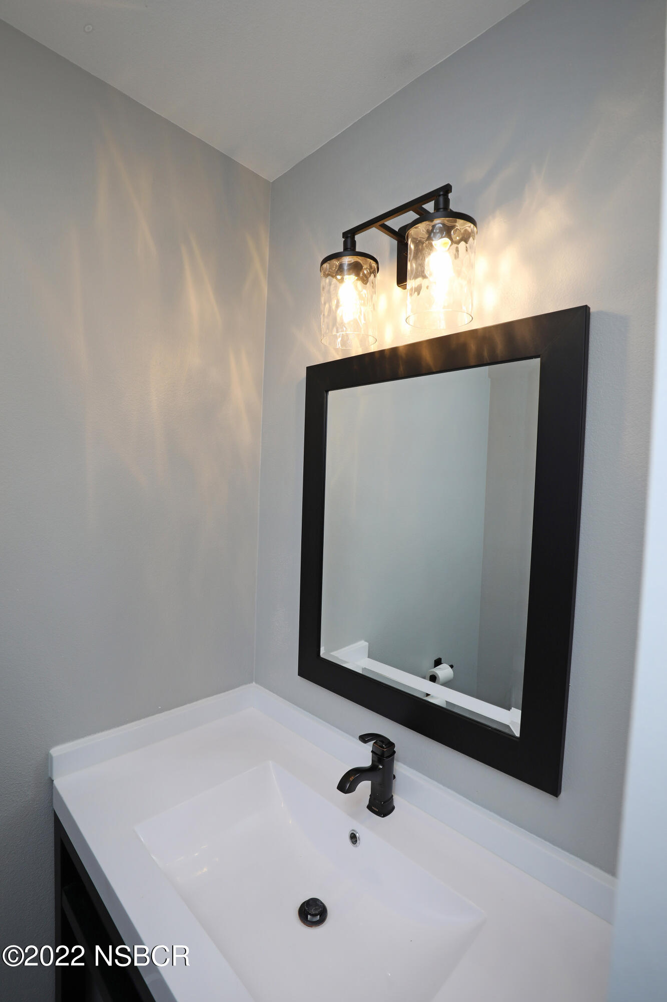 1893 Ringsted Drive Solvang, CA 93463 - Photo 31 of 43 a bathroom with a sink and mirror