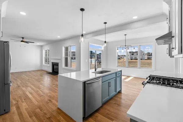 a kitchen with stainless steel appliances granite countertop a stove and refrigerator