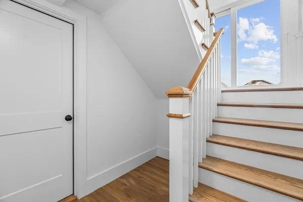 a view of staircase with wooden floor and staircase