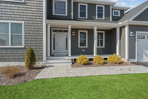 a front view of a house with a yard