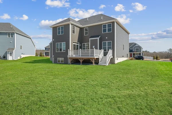 a front view of a house with a yard and porch