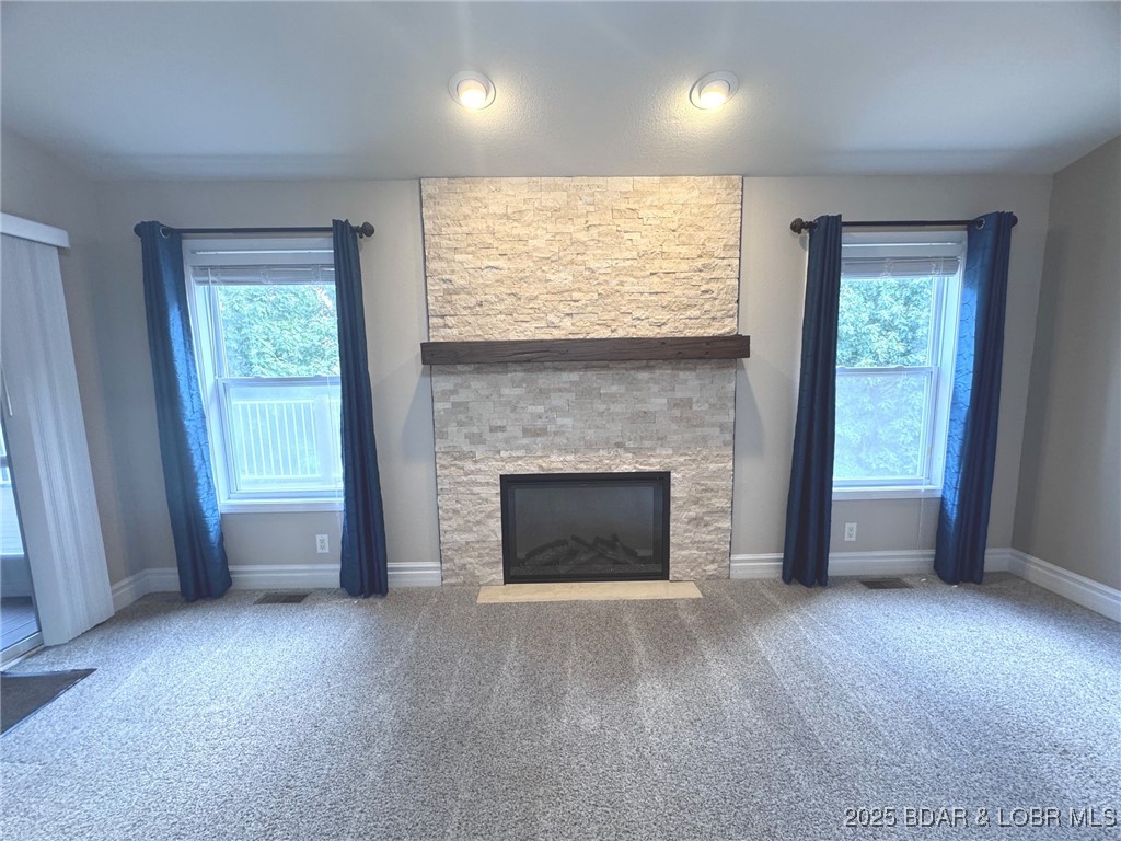 4331 Sunset Drive, Unit B Osage Beach, MO 65065 - Photo 5 of 36 Cozy fireplace (Electric) surrounded by decorative