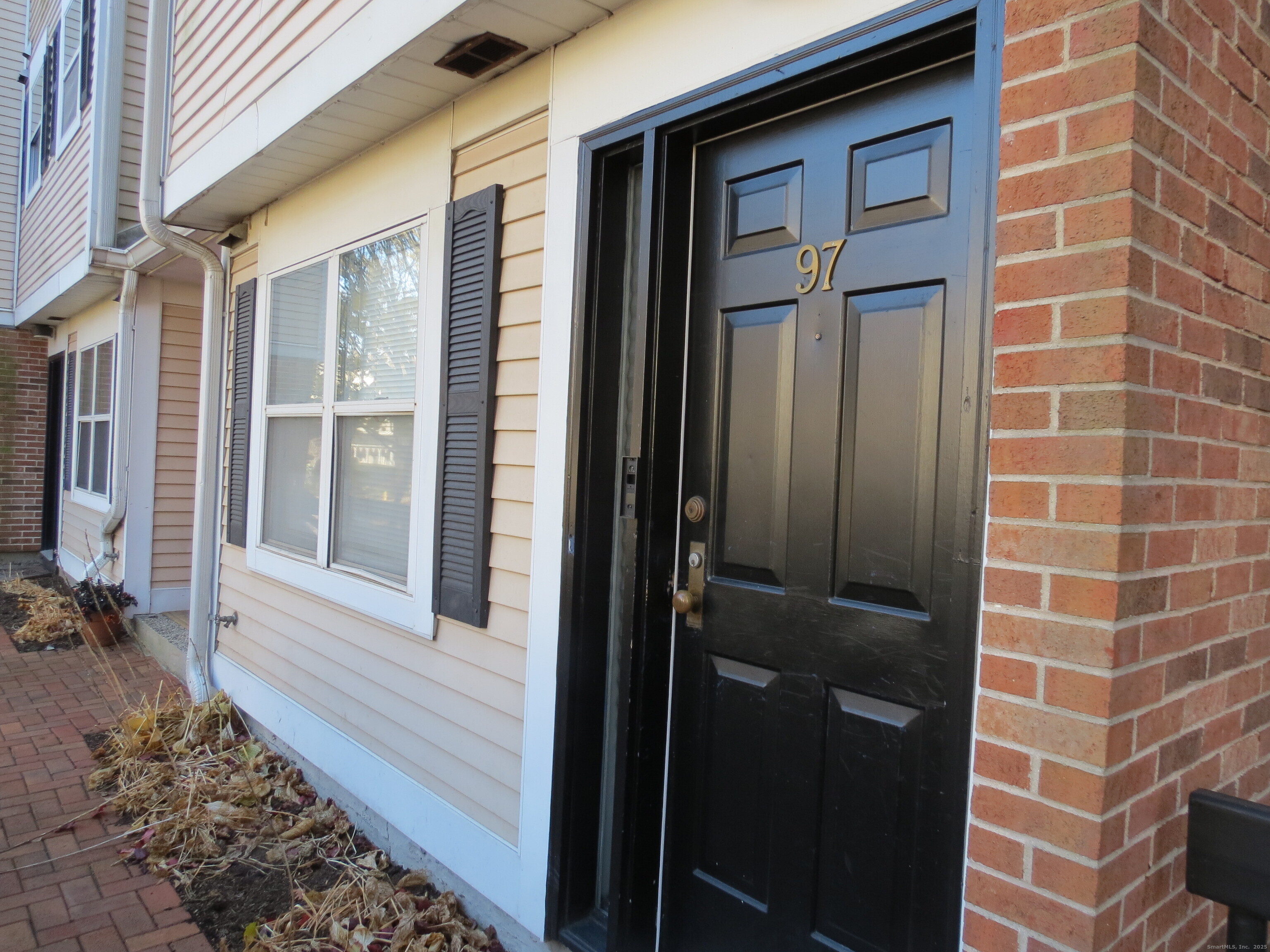 a view of a door and a window