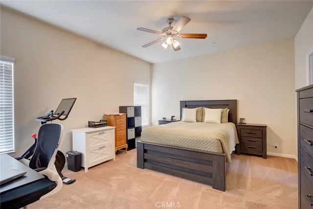 a bedroom with a bed and a television