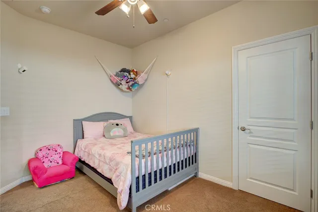 a room with a dresser and a flat screen tv