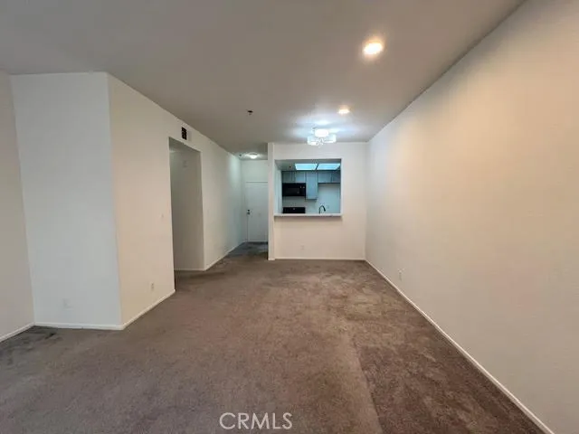 a view of a livingroom and a kitchen
