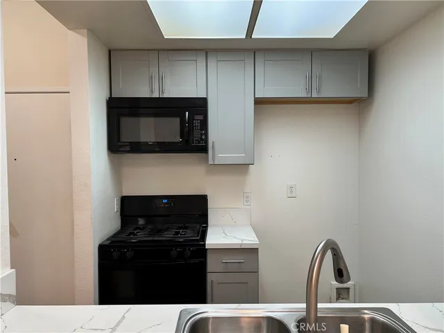 a kitchen with a stove and a microwave