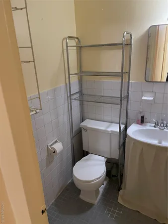 a bathroom with a toilet and a sink