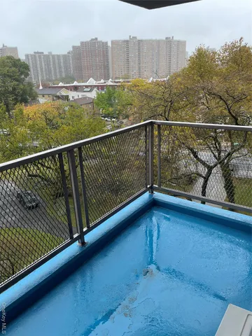 a view of balcony with furniture