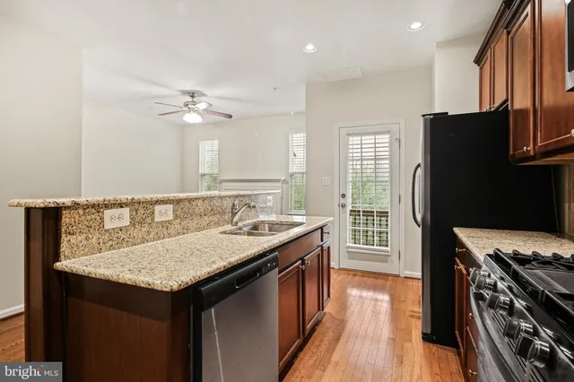 a kitchen with a counter space a sink and appliances