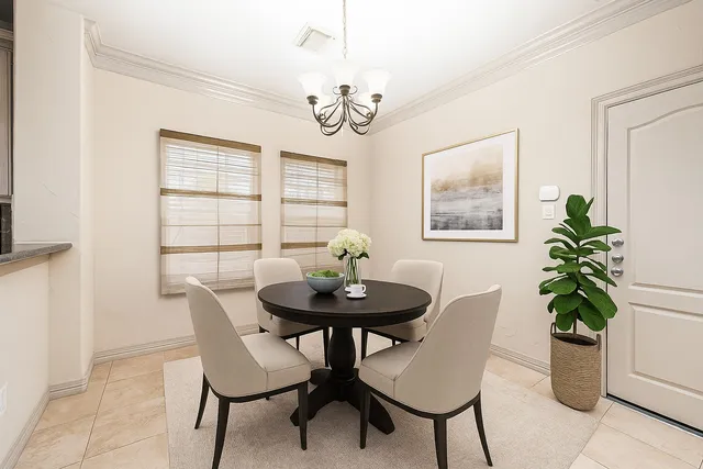 a kitchen with granite countertop a sink stove refrigerator and cabinets