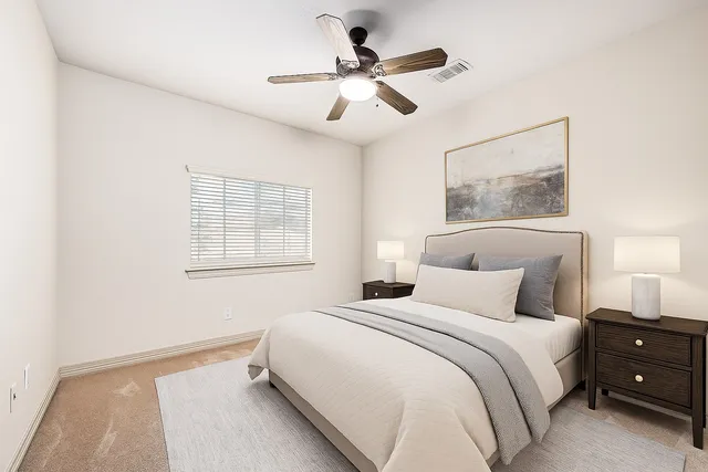a bathroom with a granite countertop sink toilet a large mirror and shower