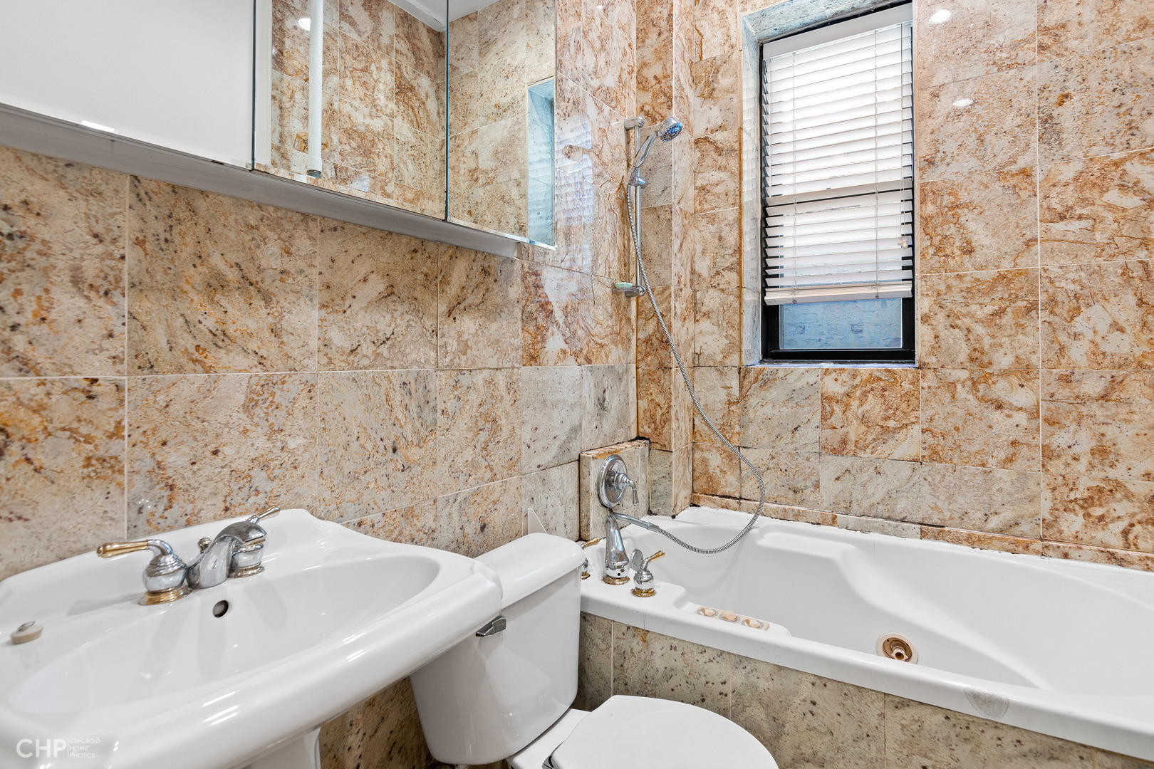20 East Goethe Street, Unit 306 Chicago, IL 60610 - Photo 13 of 14 a bathroom with a sink a toilet and a bathtub