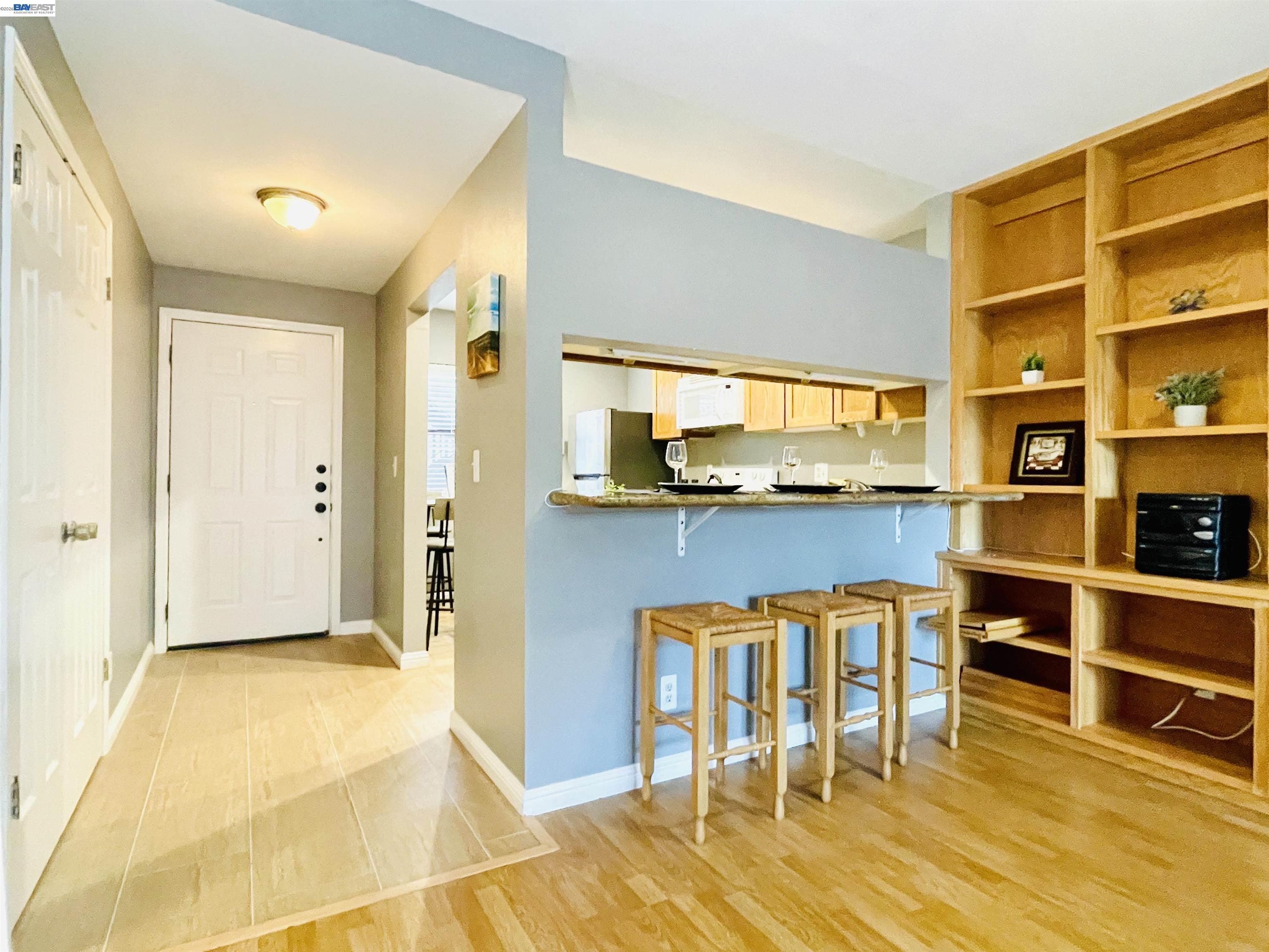 320 North Villa Way Walnut Creek, CA 94595 - Photo 11 of 36 a living room with stainless steel appliances kitchen island granite countertop furniture and a kitchen view