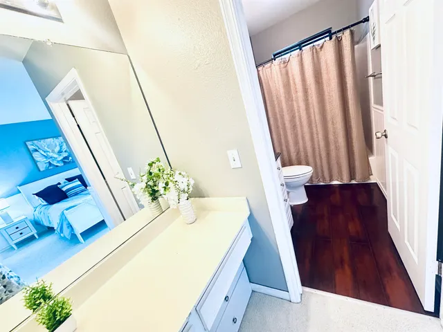 a bath room with a sink and a bath tub