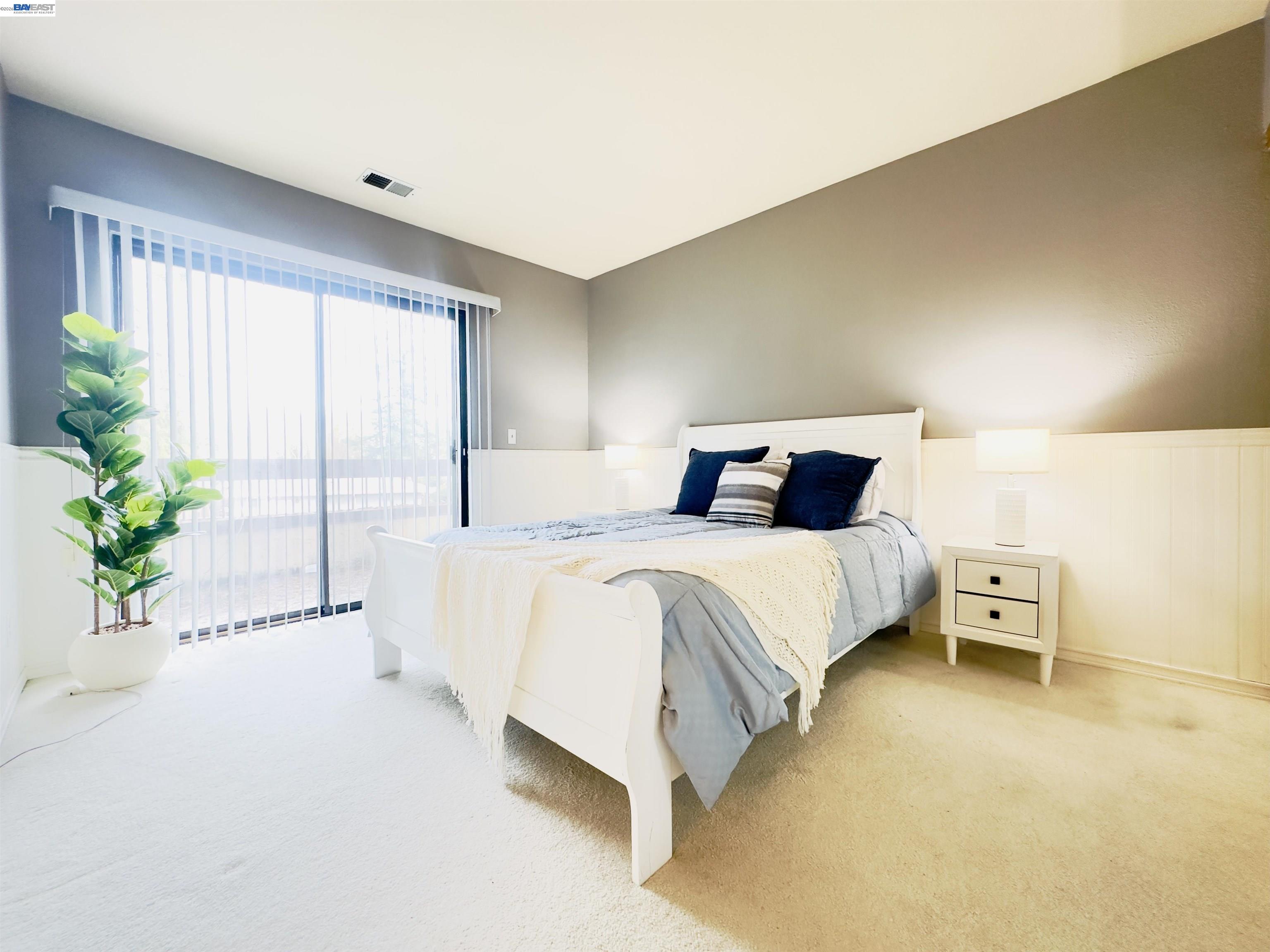 320 North Villa Way Walnut Creek, CA 94595 - Photo 16 of 36 a bedroom with a large bed and a potted plant