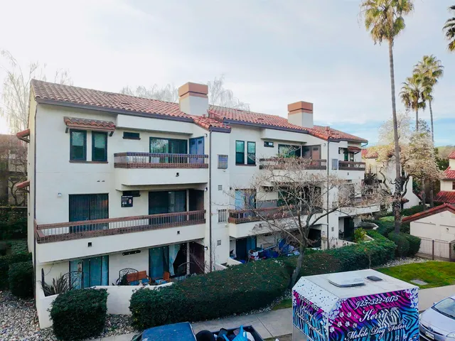 a front view of a building with garden