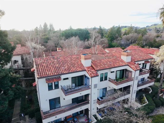 an aerial view of a house with a garden