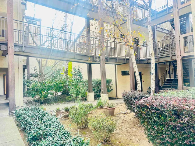 a view of a building with a garden