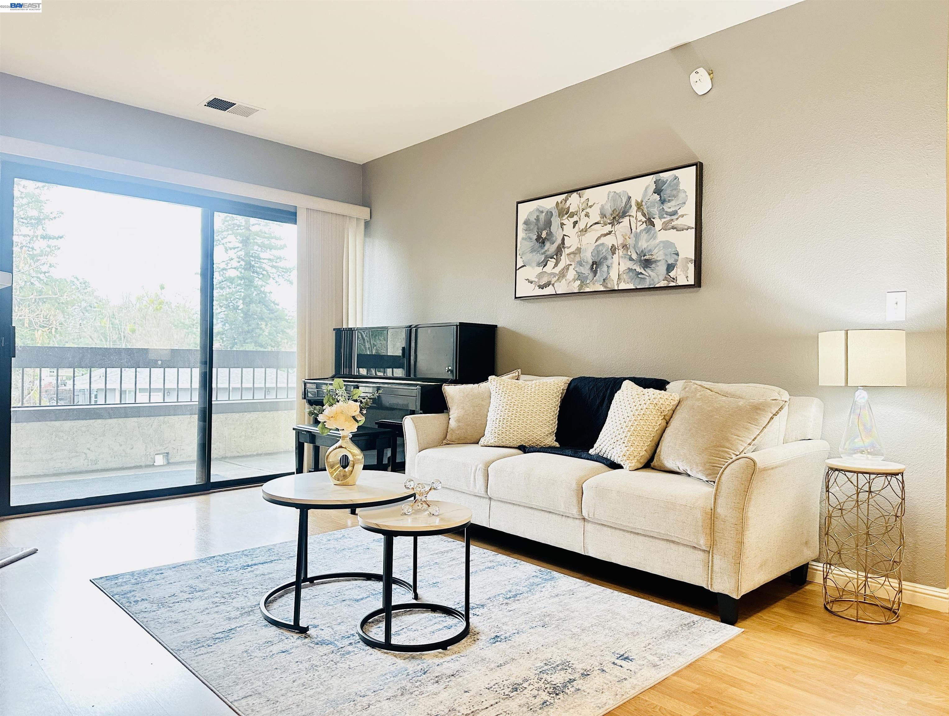 320 North Villa Way Walnut Creek, CA 94595 - Photo 7 of 36 a living room with furniture a rug and a large window