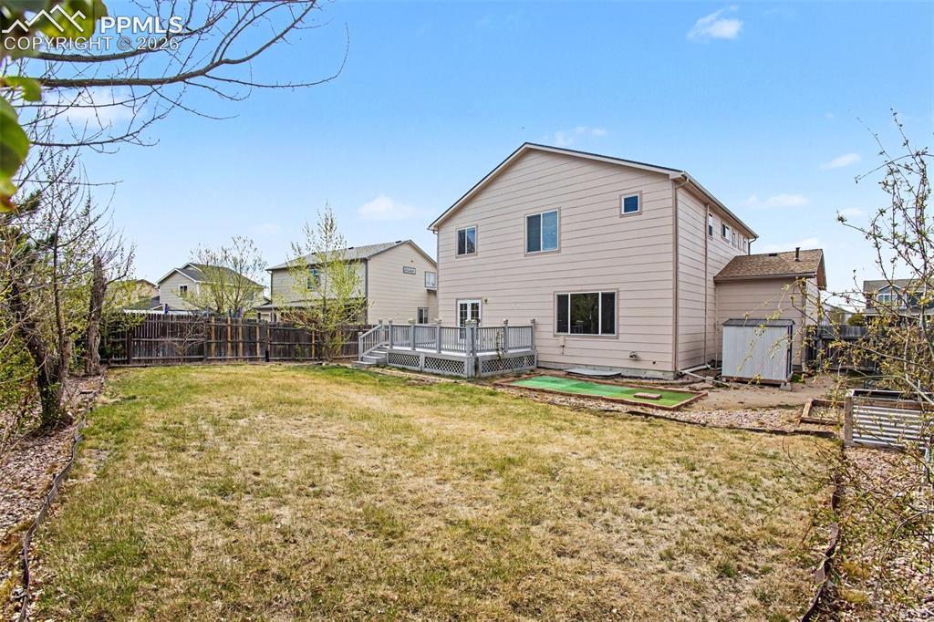 12210 Crystal Downs Road Peyton, CO 80831 - Photo 30 of 40 a view of a house with a yard