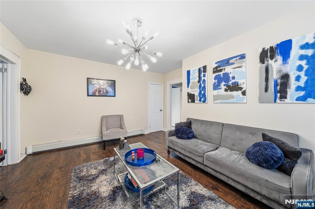 50 Unity Avenue Newark, NJ 07106 - Photo 16 of 42 a living room with furniture and a wooden floor