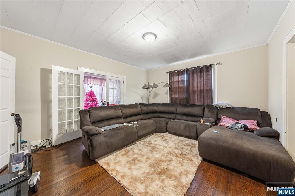 50 Unity Avenue Newark, NJ 07106 - Photo 23 of 42 a living room with furniture and a flat screen tv