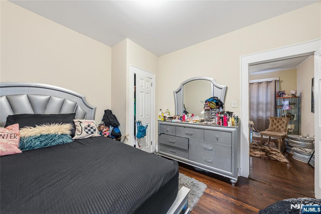 50 Unity Avenue Newark, NJ 07106 - Photo 27 of 42 a bed room with furniture and a wooden floor