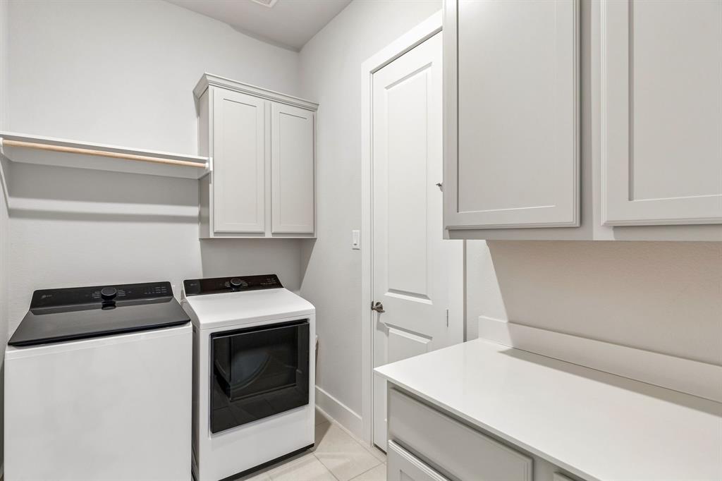 3004 Windy Rdg Road McKinney, TX 75071 - Photo 19 of 40 a utility room with dryer and washer