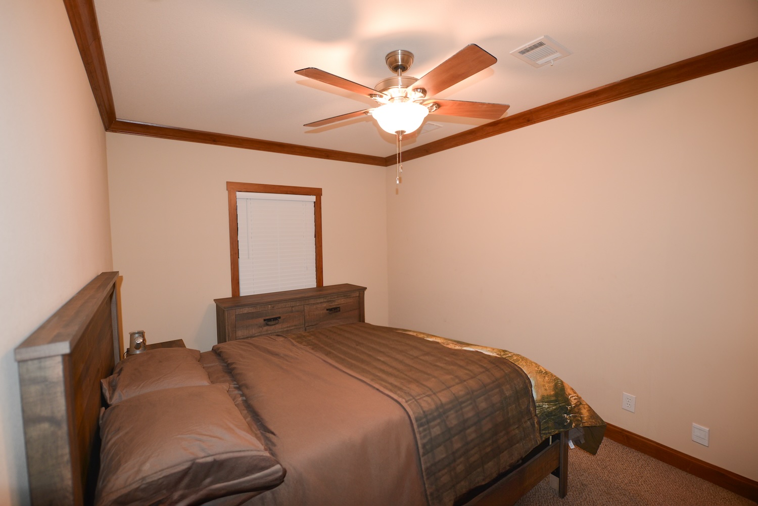 Undisclosed Address Rocksprings, TX 78880 - Photo 13 of 30 a bedroom with a bed and a chandelier