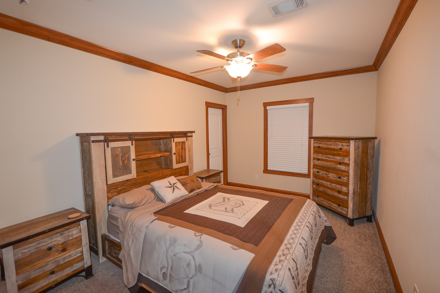 Undisclosed Address Rocksprings, TX 78880 - Photo 9 of 30 a bedroom with a bed and a chandelier