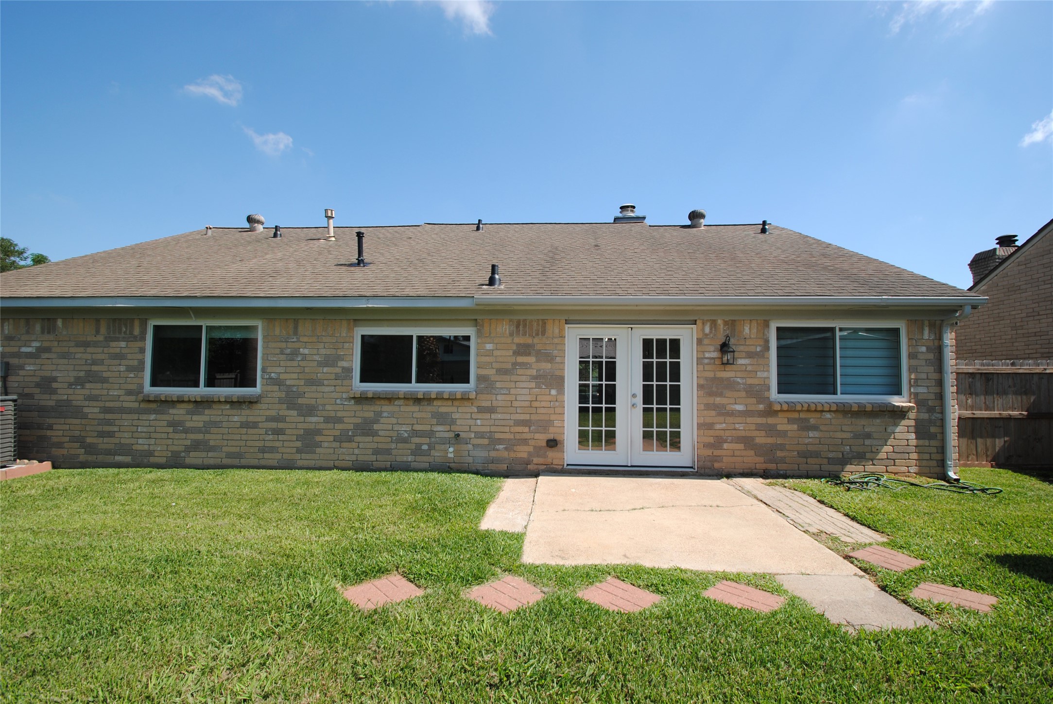 22831 John Rolfe Lane Katy, TX 77449 - Photo 32 of 34 a front view of a house with a yard