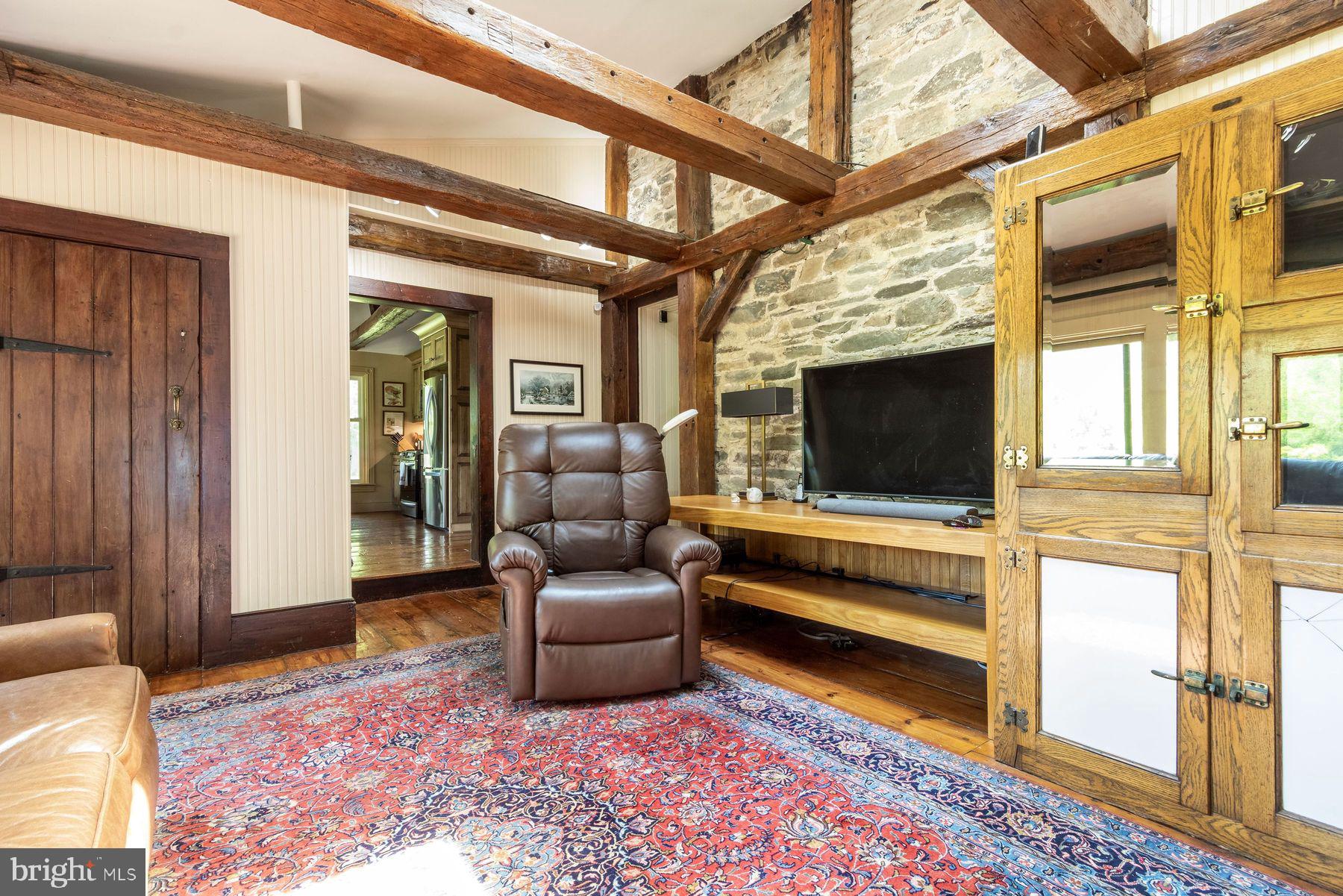 3150 Rushland Road Jamison, PA 18929 - Photo 27 of 50 a living room with furniture wooden floor and a flat screen tv