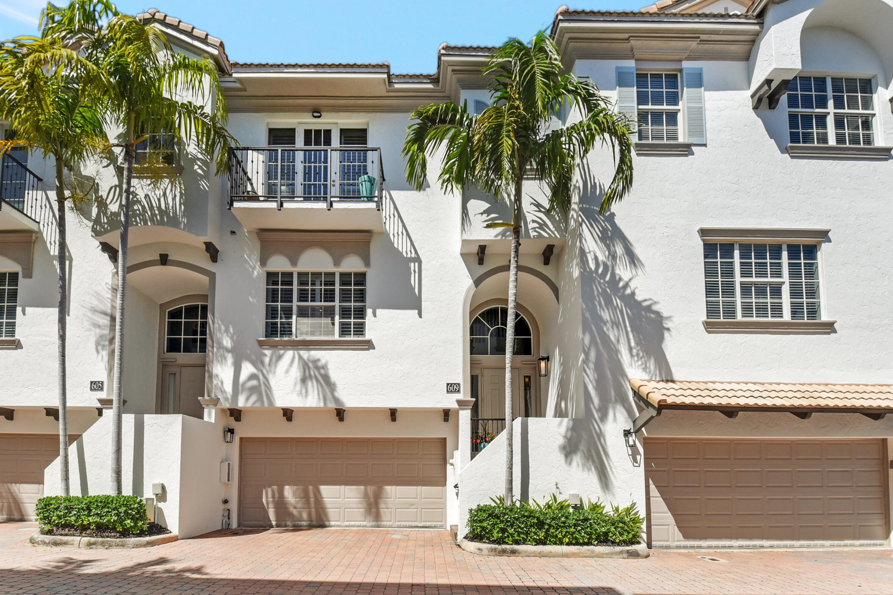 609 Renaissance Way Delray Beach, FL 33483 - Photo 18 of 22 a front view of a house with a tree
