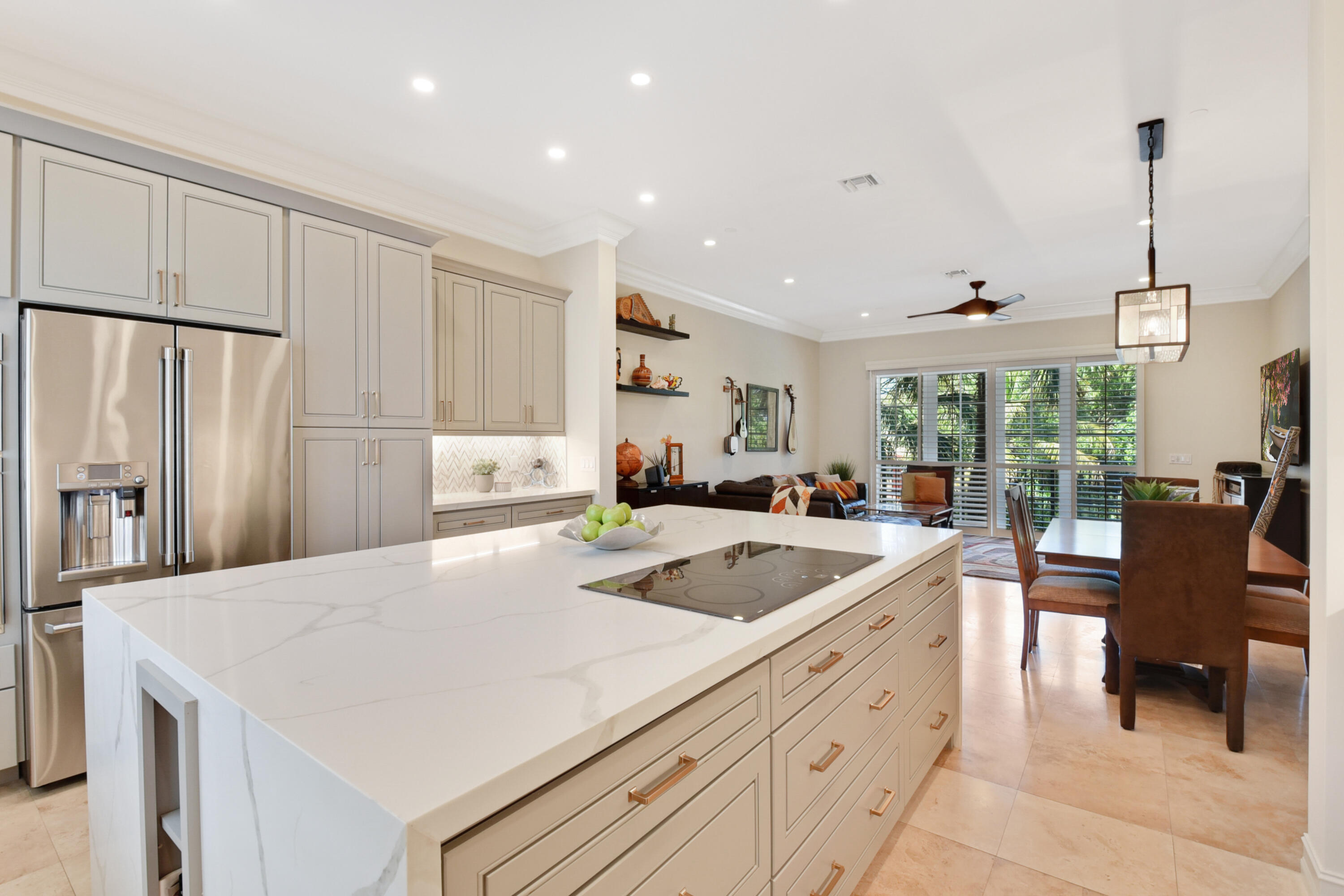 609 Renaissance Way Delray Beach, FL 33483 - Photo 4 of 22 a kitchen with stainless steel appliances granite countertop a sink a stove and a refrigerator
