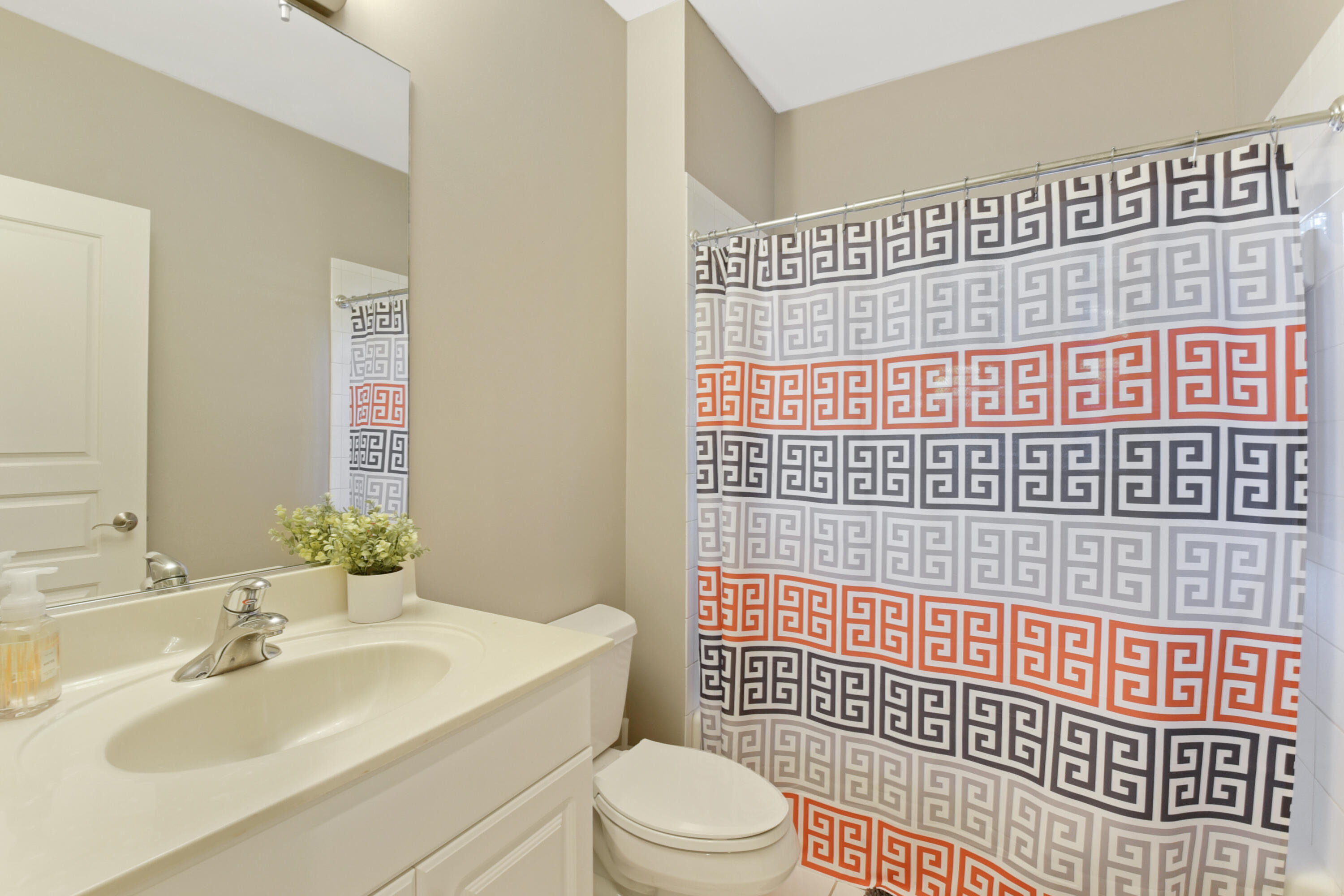 609 Renaissance Way Delray Beach, FL 33483 - Photo 10 of 22 a bathroom with a sink toilet and shower