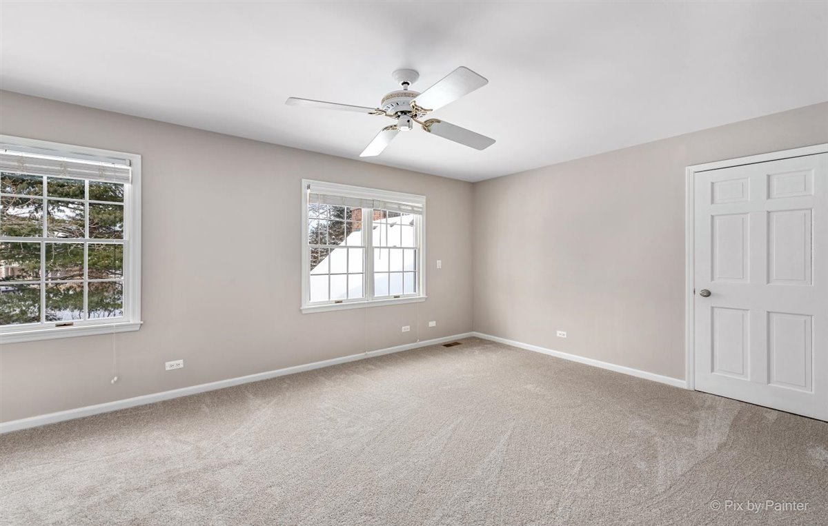230 Perth Road Cary, IL 60013 - Photo 34 of 52 an empty room with windows and fan
