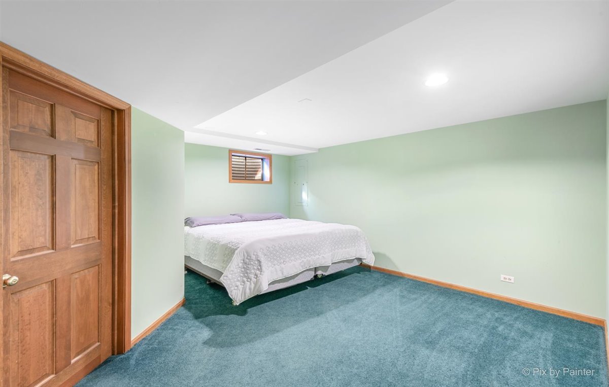 230 Perth Road Cary, IL 60013 - Photo 41 of 52 a bedroom with a bed and a window